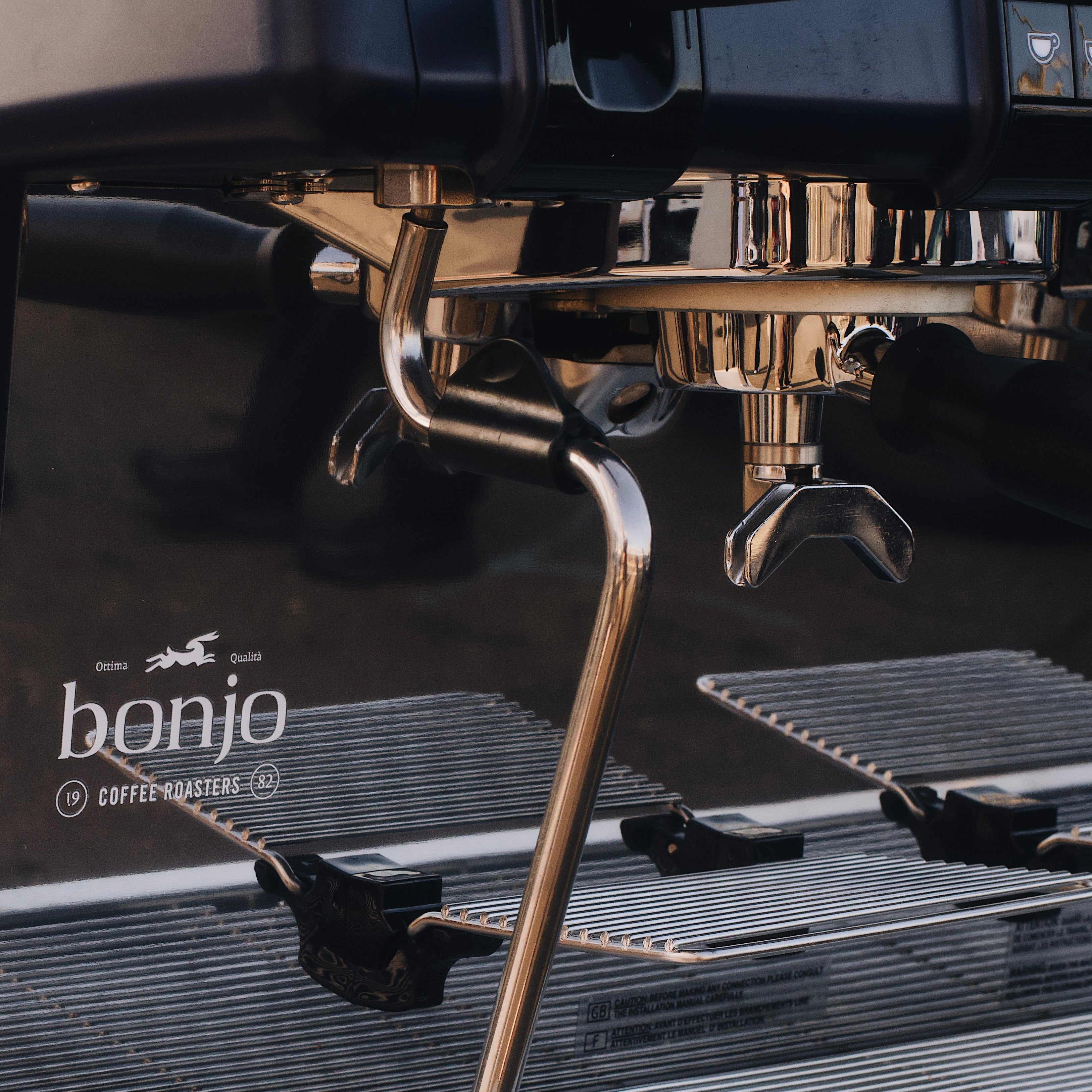 Close-up of a Bonjo coffee machine with brewing components.